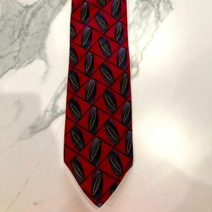 A Van-Heusen , red with the wonderful shade of blue and green tie .